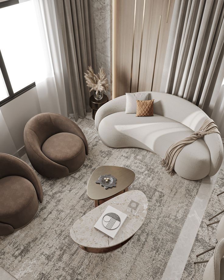 Living room with a curved sofa and lounge chairs